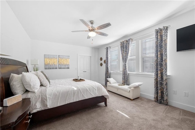 bedroom with ceiling fan and light colored carpet