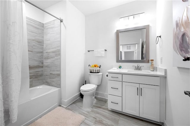 full bathroom with tiled shower / bath combo, vanity, and toilet