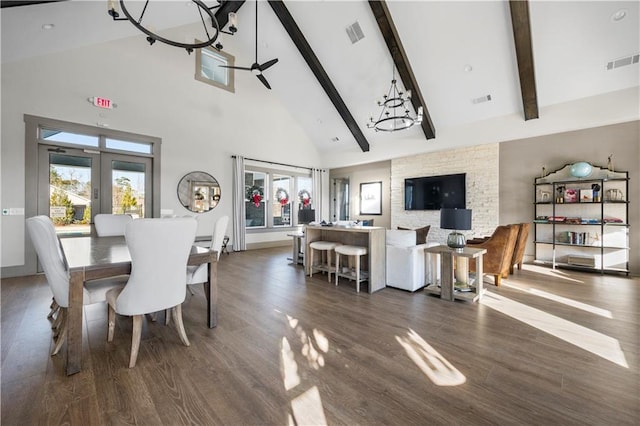 dining area featuring beam ceiling, ceiling fan with notable chandelier, high vaulted ceiling, and dark wood-type flooring