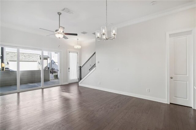 kitchen featuring decorative light fixtures, crown molding, wall chimney exhaust hood, dark hardwood / wood-style flooring, and a kitchen island with sink