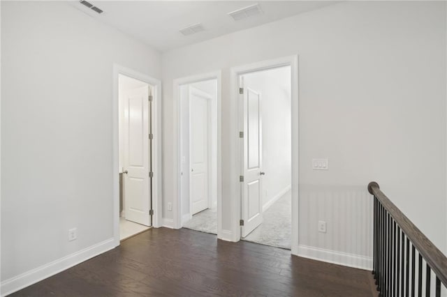 unfurnished room featuring dark wood-type flooring