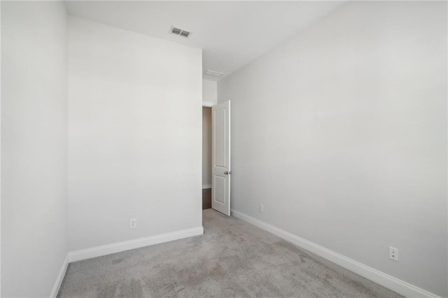 unfurnished room with light colored carpet