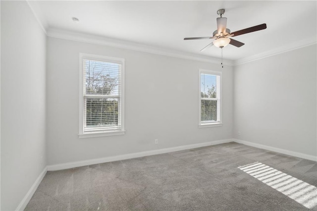 spare room with ornamental molding, light colored carpet, and ceiling fan