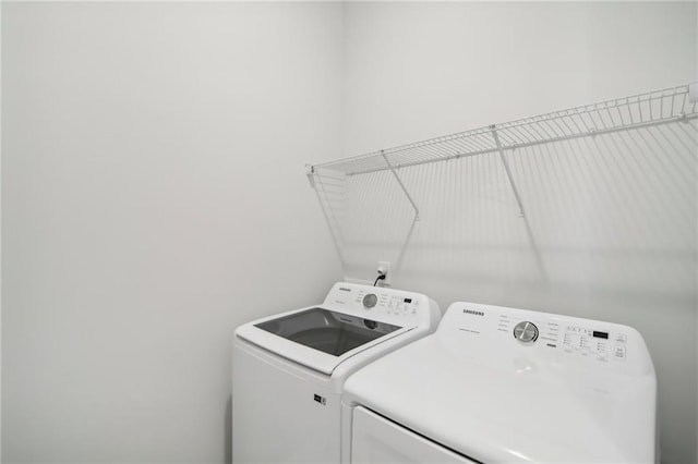 laundry room featuring washing machine and dryer