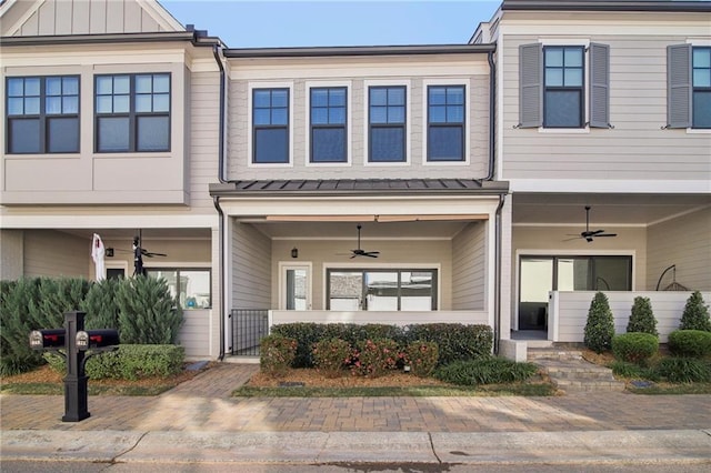671 Stickley Oak Way, Woodstock, GA 30189 - townhome / multi-family property featuring a ceiling fan, a porch, and a gate