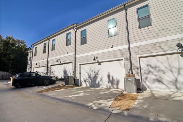 rear view of property featuring a garage