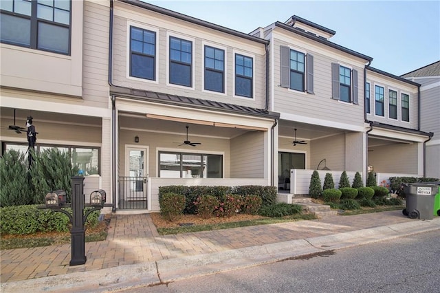 671 Stickley Oak Way, Woodstock, GA 30189 - multi unit property featuring a ceiling fan, a gate, a standing seam roof, a fenced front yard, and metal roof