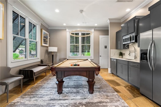 recreation room featuring pool table, ornamental molding, and sink