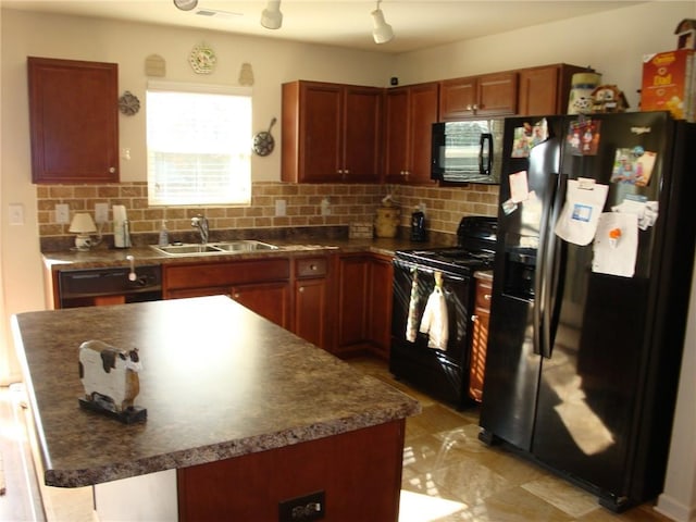 kitchen with tasteful backsplash, sink, black appliances, and a center island