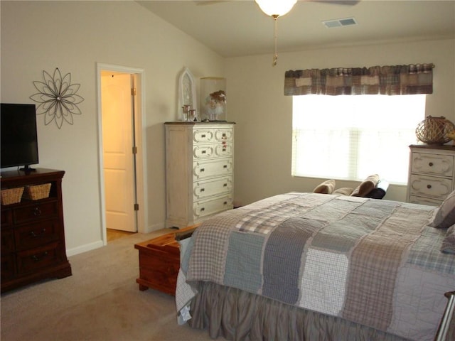 carpeted bedroom featuring lofted ceiling and ceiling fan