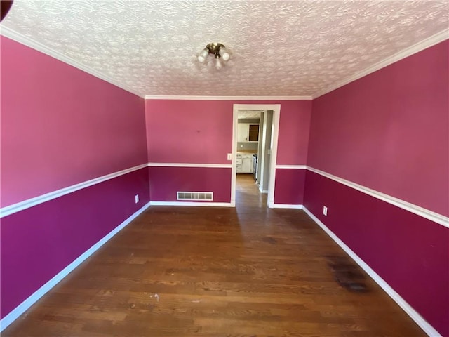 unfurnished room featuring dark wood-type flooring, a textured ceiling, and crown molding