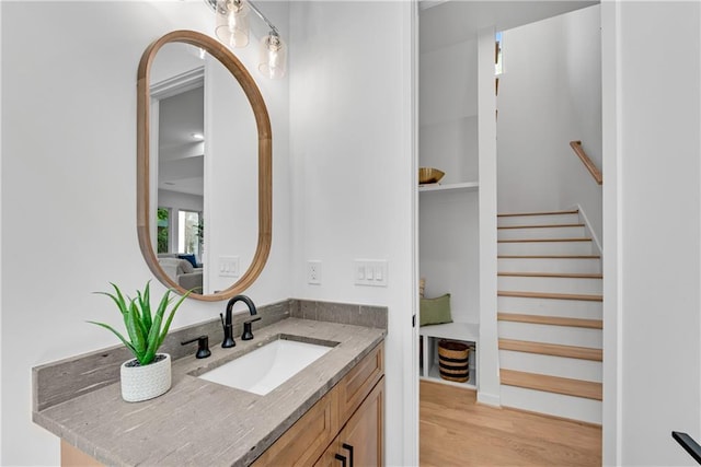 bathroom with hardwood / wood-style flooring and vanity