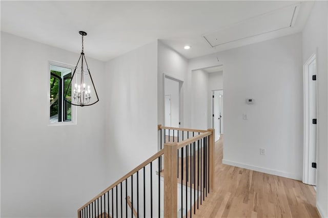 hallway with light hardwood / wood-style floors