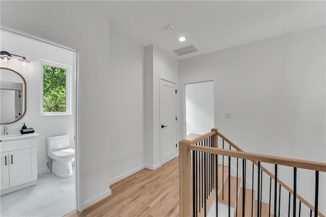 hallway with light wood-type flooring