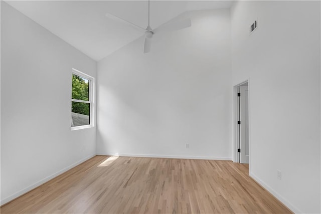 unfurnished room featuring ceiling fan, light hardwood / wood-style flooring, and high vaulted ceiling