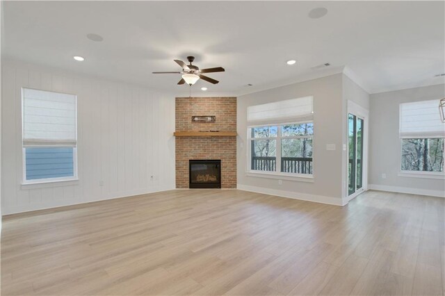 kitchen with light countertops, appliances with stainless steel finishes, under cabinet range hood, and a sink