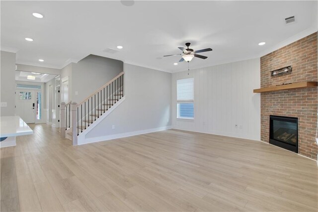kitchen featuring a sink, light wood-type flooring, ceiling fan, gray cabinets, and dishwasher