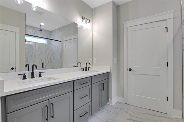 kitchen featuring baseboards, a ceiling fan, stainless steel appliances, and light countertops