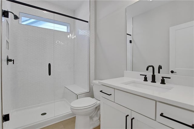 full bathroom with a shower stall, toilet, and vanity