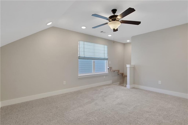 carpeted empty room featuring recessed lighting, a ceiling fan, and baseboards