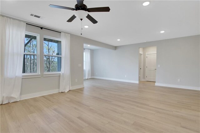 empty room with recessed lighting, visible vents, baseboards, light wood-style flooring, and ceiling fan