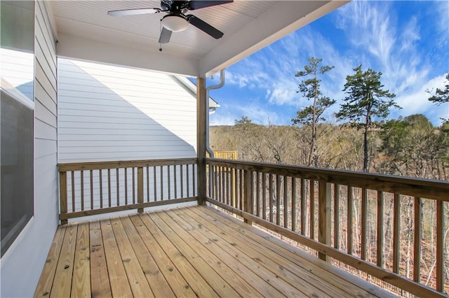 wooden terrace featuring ceiling fan