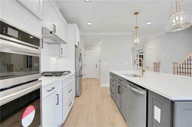 full bath featuring baseboards, marble finish floor, a sink, and double vanity