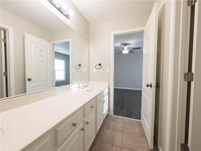 bathroom with tile patterned floors, ceiling fan, and vanity