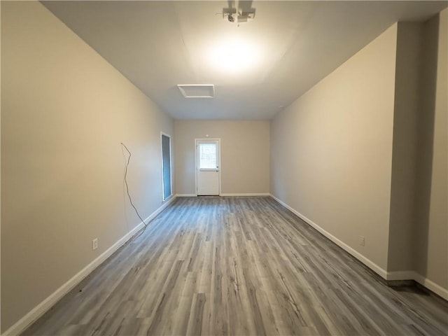 empty room with wood-type flooring