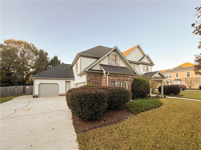 view of front of house featuring a front yard and a garage