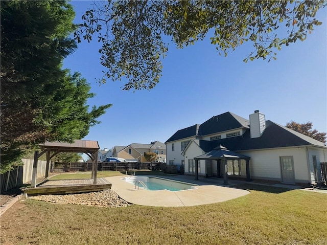 view of swimming pool featuring a gazebo and a yard