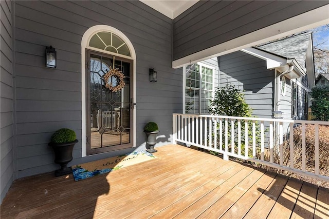 wooden terrace with a porch