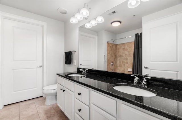 full bathroom with a sink, visible vents, toilet, and tile patterned flooring