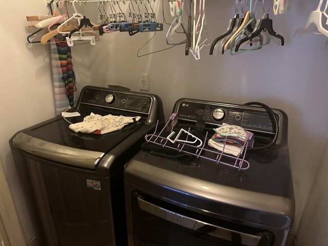 clothes washing area featuring washing machine and dryer