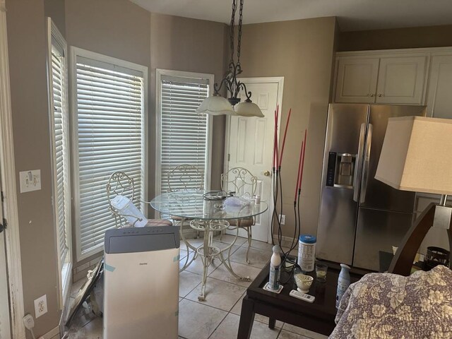 dining area featuring light tile patterned floors