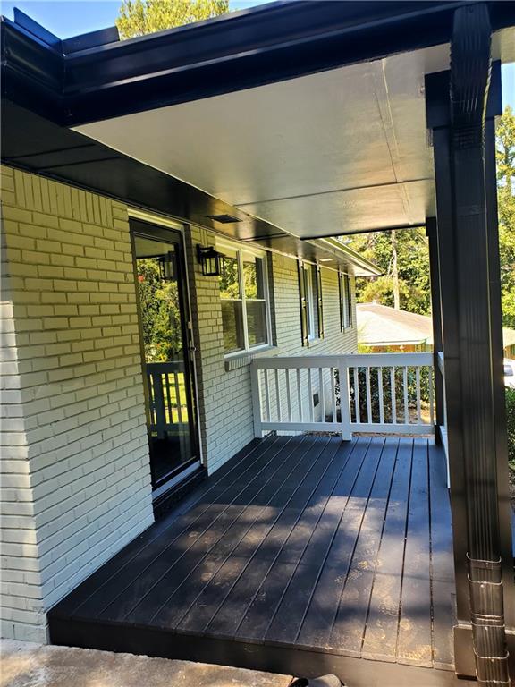 wooden terrace with a porch