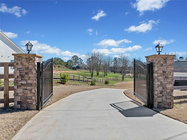 view of gate with fence