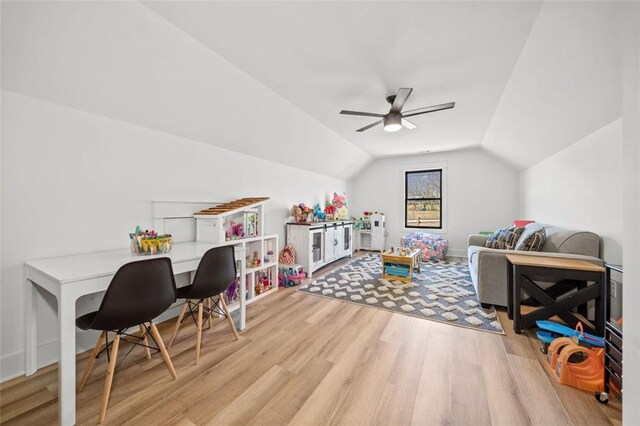 game room with lofted ceiling, ceiling fan, and wood finished floors