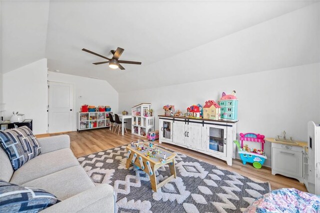 game room featuring lofted ceiling, ceiling fan, and wood finished floors