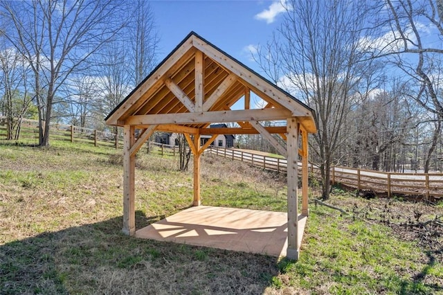 view of yard with fence and a gazebo