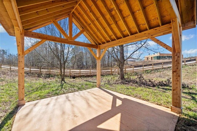 view of patio / terrace featuring fence