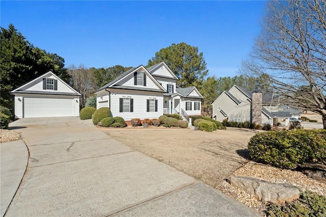 view of front of house featuring a garage and an outdoor structure