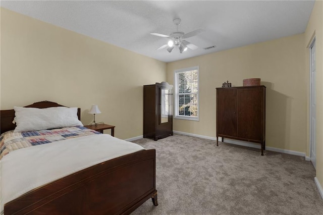 bedroom featuring light carpet and ceiling fan