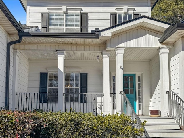 view of exterior entry featuring a porch