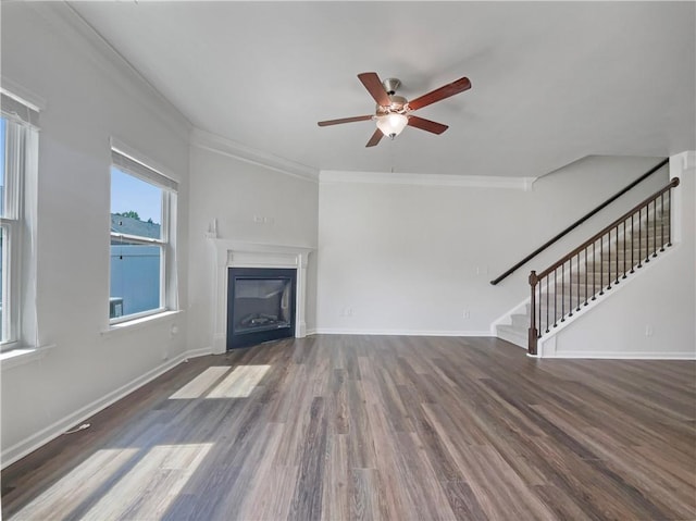 36 Crescent, Dallas, GA 30157 - unfurnished living room featuring ceiling fan, wood finished floors, stairway, ornamental molding, and a glass covered fireplace