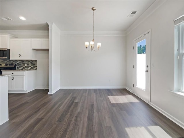36 Crescent, Dallas, GA 30157 - unfurnished dining area featuring a chandelier, ornamental molding, and dark wood-type flooring