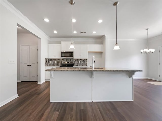 36 Crescent, Dallas, GA 30157 - kitchen with stainless steel appliances, white cabinets, dark wood-style flooring, a kitchen island with sink, and a kitchen bar