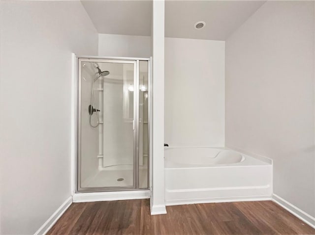 36 Crescent, Dallas, GA 30157 - bathroom featuring a stall shower, wood finished floors, and a garden tub