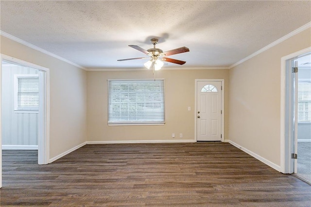 entryway featuring a textured ceiling, a wealth of natural light, dark hardwood / wood-style floors, and ceiling fan