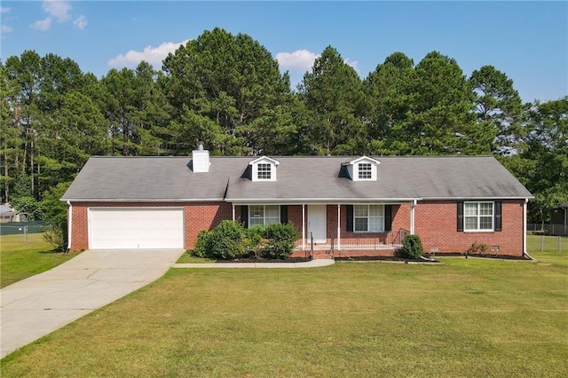 cape cod-style house featuring a front lawn and a garage